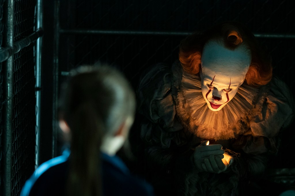Pennywise appears in front of a child.